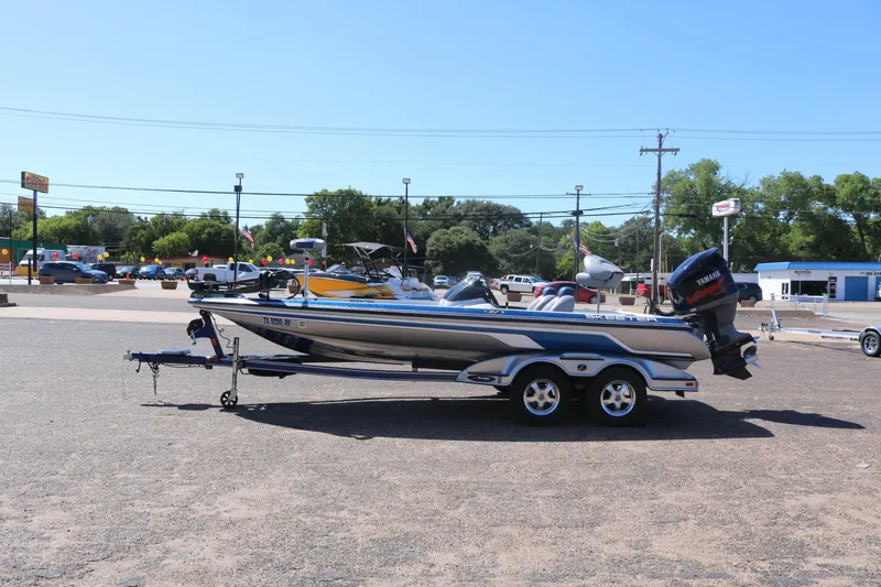 Slide: The Image of 2009 Skeeter 20i boat on trailer in parking lot, sunny day. - 4