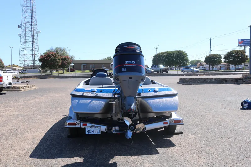 Slide: The Image of 2009 Skeeter 20i boat with Yamaha 250 engine, parked in a lot, rear view. - 5