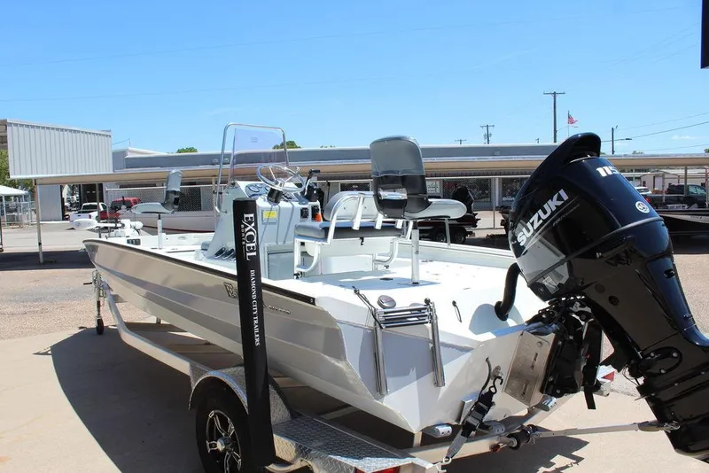 Slide: The Image of 2022 Excel Bay Pro 203 boat with Suzuki outboard motor on trailer. - 10