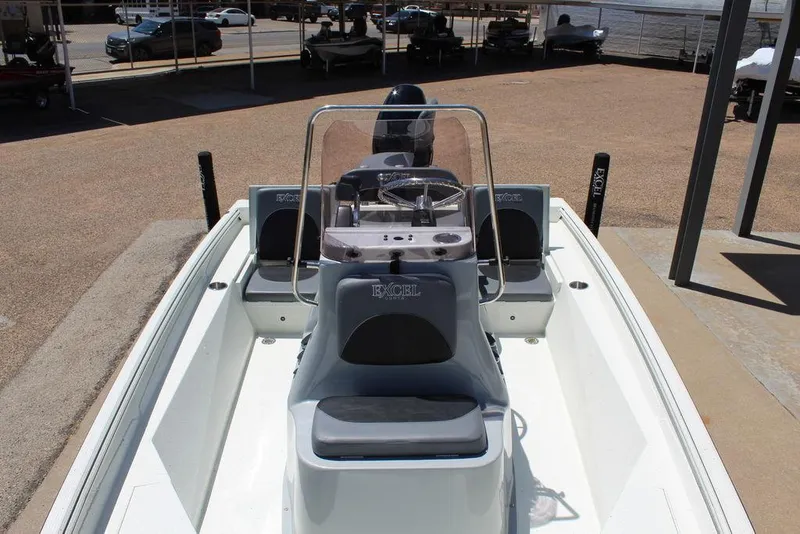 Slide: The Image of 2022 Excel Bay Pro 203 boat interior with console and seating. - 15