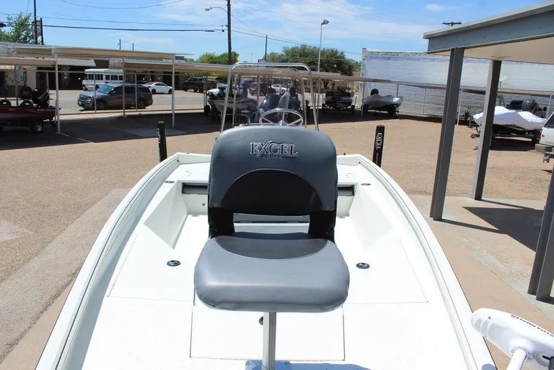 Slide: The Image of 2022 Excel Bay Pro 203 boat with center console and seating. - 5