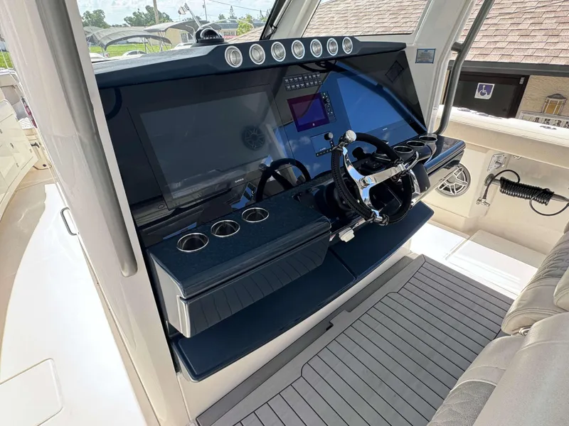 Slide: The Image of 2023 Solace 41 CS boat helm with modern controls and navigation system. - 14