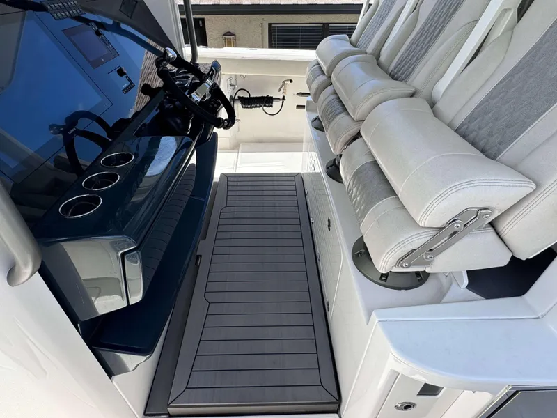 Slide: The Image of 2023 Solace 41 CS boat cockpit with helm and cushioned seating. - 15