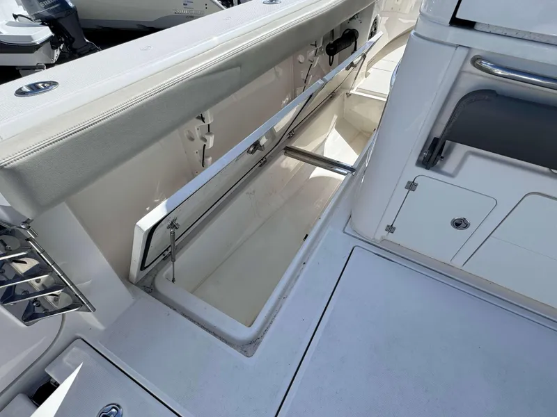 Slide: The Image of Open storage compartment on a 2023 Solace 41 CS boat. - 23