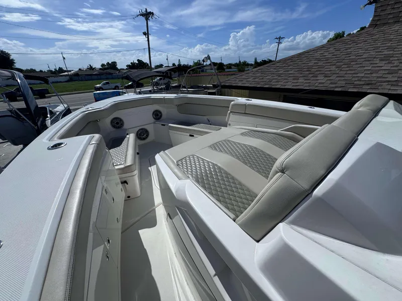 Slide: The Image of 2023 Solace 41 CS boat interior with cushioned seating and storage compartments. - 27