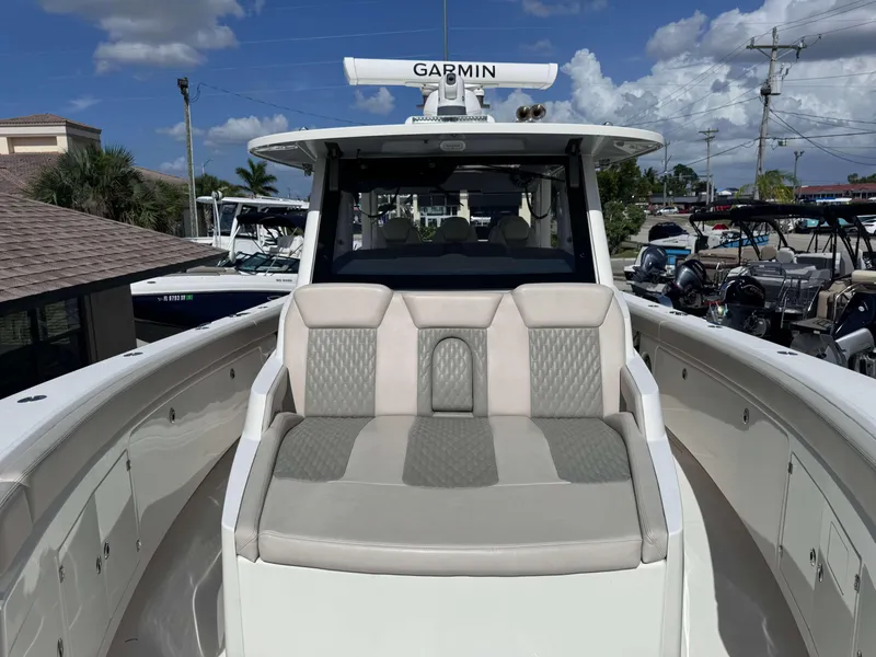 Slide: The Image of 2023 Solace 41 CS boat with Garmin navigation system and cushioned seating. - 29