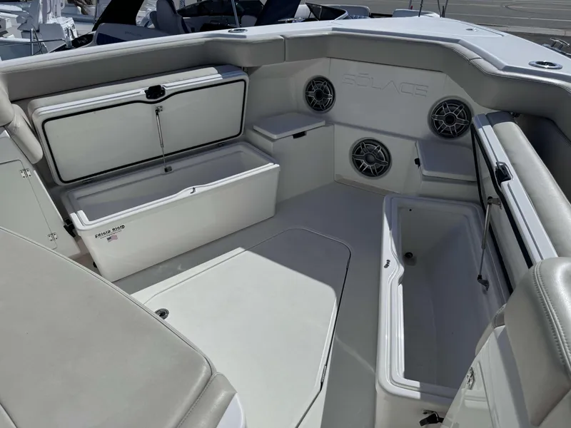 Slide: The Image of 2023 Solace 41 CS boat interior with storage compartments and speakers. - 30