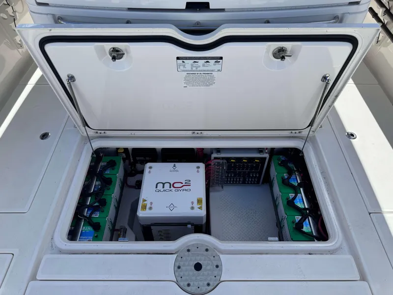 Slide: The Image of Open engine compartment of 2023 Solace 41 CS boat showing MC2 Quick Gyro stabilizer and batteries. - 35