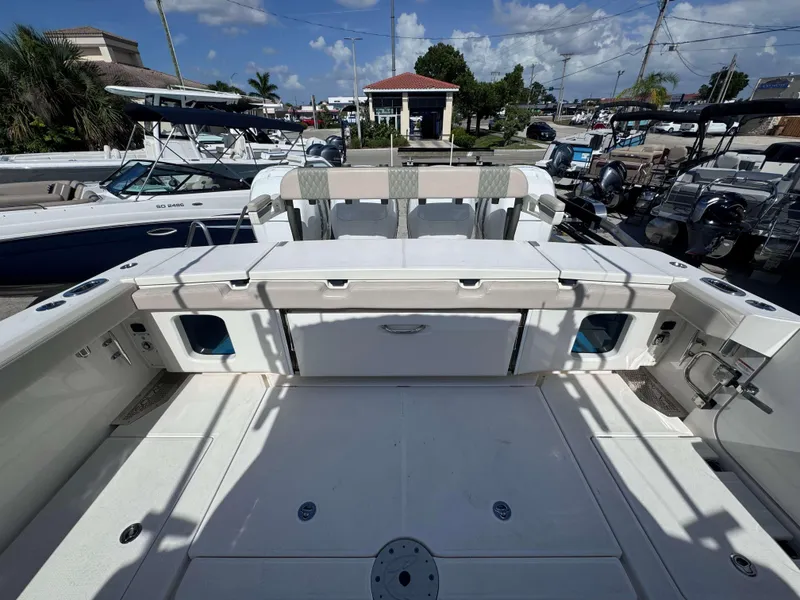 Slide: The Image of 2023 Solace 41 CS boat deck with storage compartments and seating. - 7