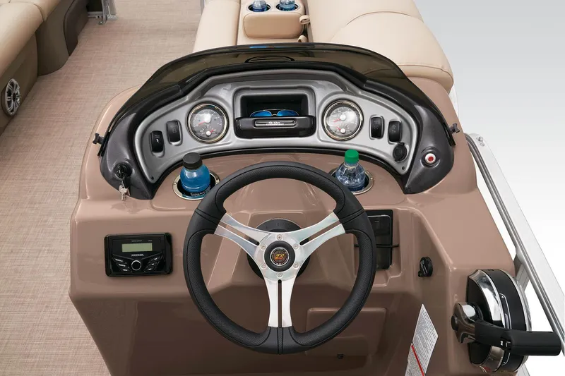 Slide: The Image of 2023 Sun Tracker SportFish 22 DLX boat dashboard with steering wheel and control panel. - 24