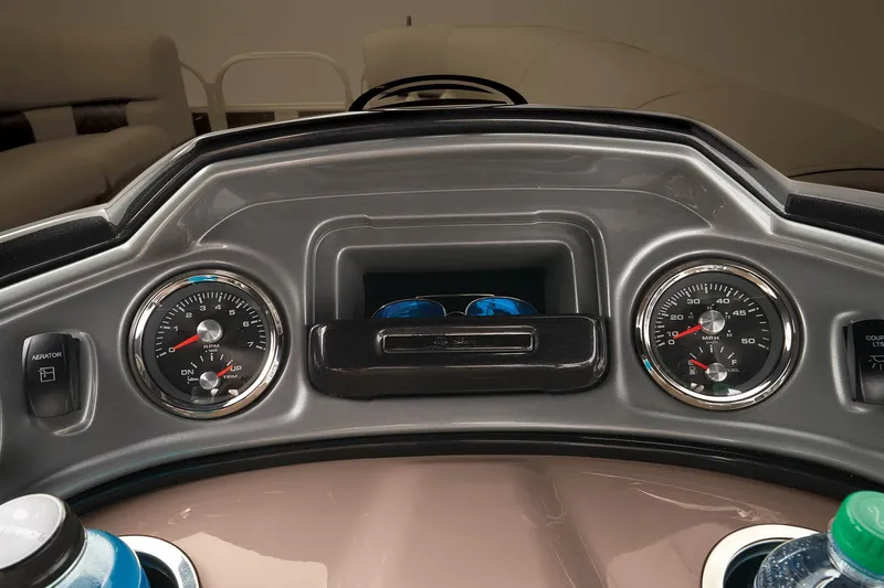 Slide: The Image of Dashboard of 2023 Sun Tracker SportFish 22 DLX pontoon boat with gauges and storage. - 25
