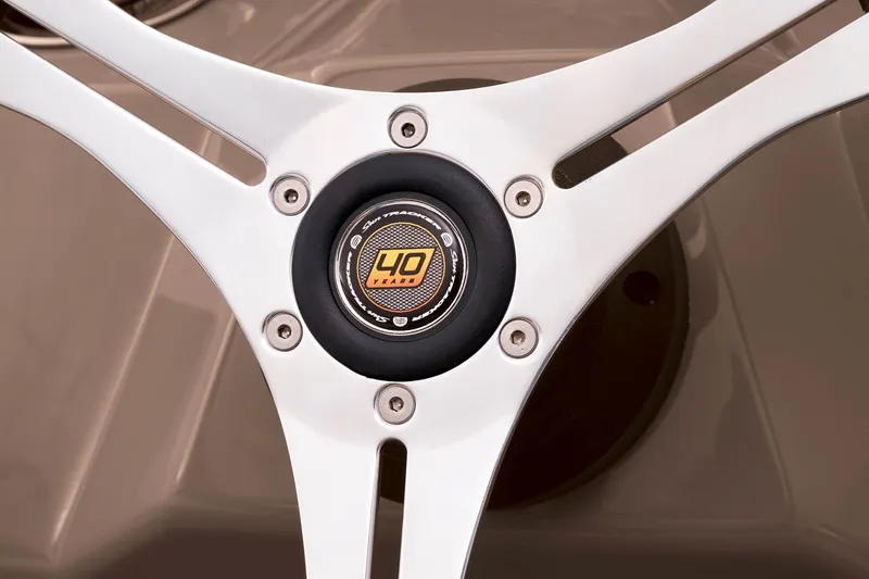 Slide: The Image of Close-up of the steering wheel on a 2023 Sun Tracker SportFish 22 DLX boat. - 26