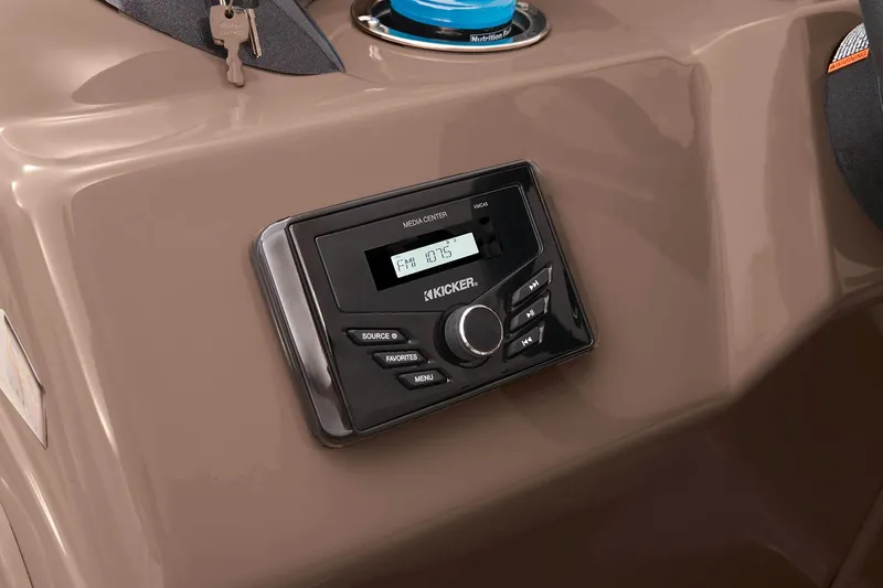 Slide: The Image of 2023 Sun Tracker SportFish 22 DLX boat dashboard with Kicker stereo system. - 27