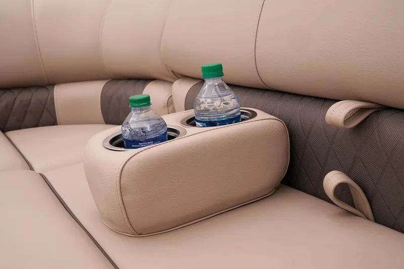 Slide: The Image of 2023 Sun Tracker SportFish 22 DLX boat interior with cup holders and water bottles. - 39