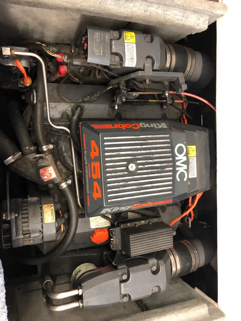 Slide: The Image of 1992 Four Winns 220 Horizon Open Bow boat engine compartment with OMC King Cobra 454 engine. - 10