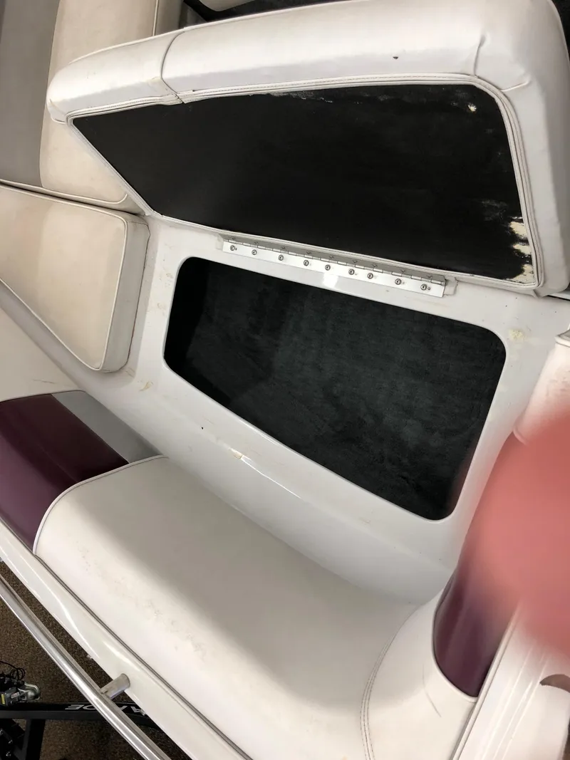 Slide: The Image of Open storage compartment in a 1992 Four Winns 220 Horizon Open Bow boat. - 15