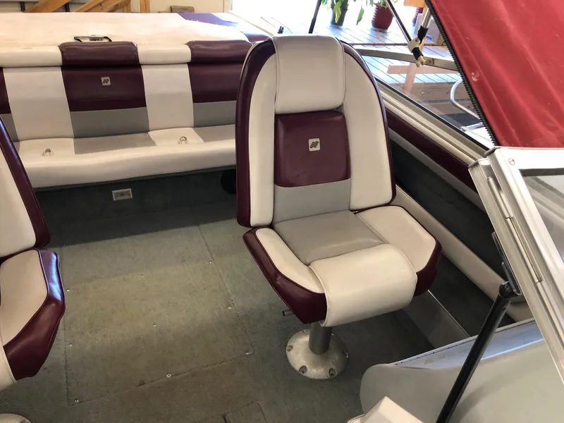 Slide: The Image of 1992 Four Winns 220 Horizon Open Bow boat interior with maroon and white seating. - 17