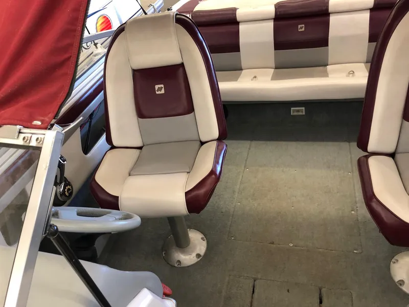 Slide: The Image of 1992 Four Winns 220 Horizon Open Bow boat interior with red and white seats. - 18