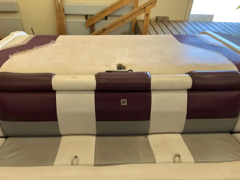 Slide: The Image of 1992 Four Winns 220 Horizon Open Bow boat interior with purple and white upholstery. - 6