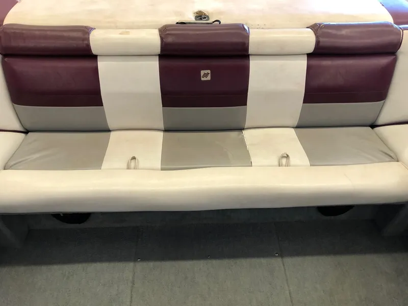 Slide: The Image of 1992 Four Winns 220 Horizon Open Bow boat seat with maroon, white, and gray upholstery. - 7