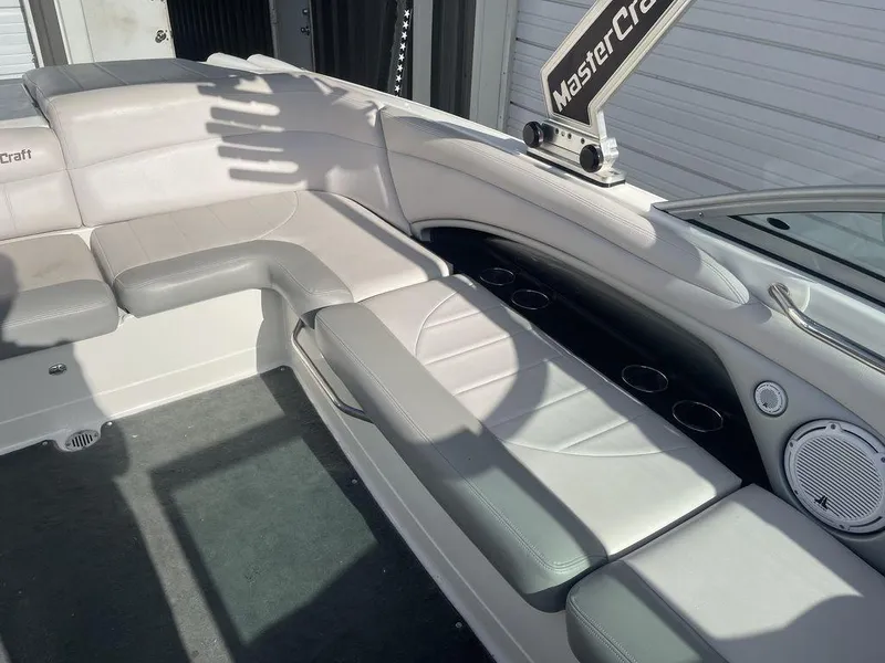 Slide: The Image of 2008 MasterCraft X45 boat interior with white and gray seating. - 10