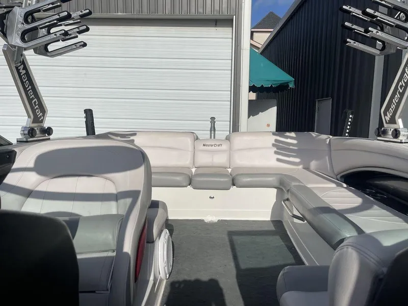 Slide: The Image of Interior of a 2008 MasterCraft X45 boat with white and gray seating. - 12