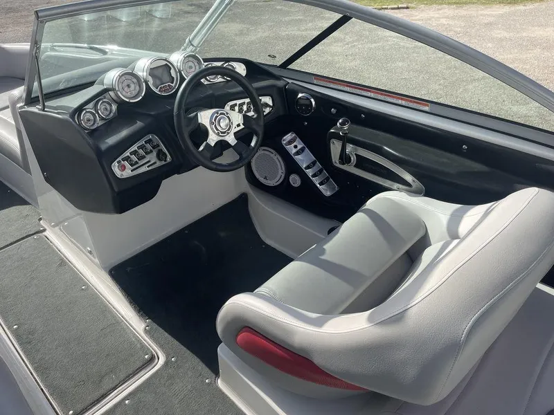 Slide: The Image of 2008 MasterCraft X45 boat cockpit with steering wheel and control panel. - 7