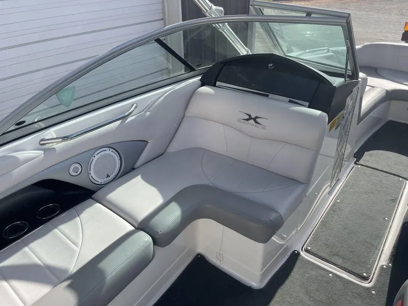 Slide: The Image of 2008 MasterCraft X45 boat interior with white and gray seating. - 9