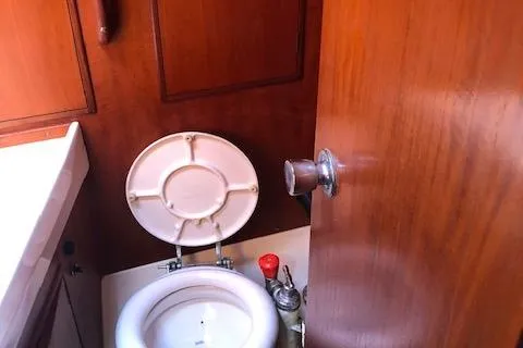Slide: The Image of Interior of 1981 Nautor Swan 371 Sloop showing compact marine toilet. - 17