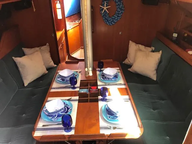 Slide: The Image of Interior of 1981 Nautor Swan 371 Sloop with dining table set for four. - 2