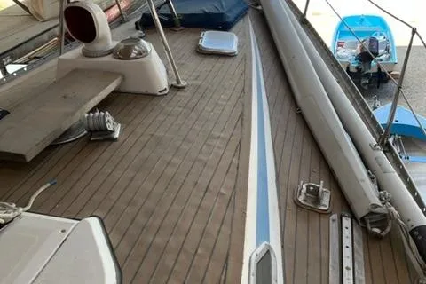 Slide: The Image of 1981 Nautor Swan 371 Sloop deck with wooden finish and sailing equipment. - 26