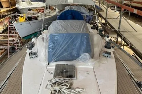 Slide: The Image of 1981 Nautor Swan 371 Sloop in storage, covered and secured, with visible deck equipment. - 28