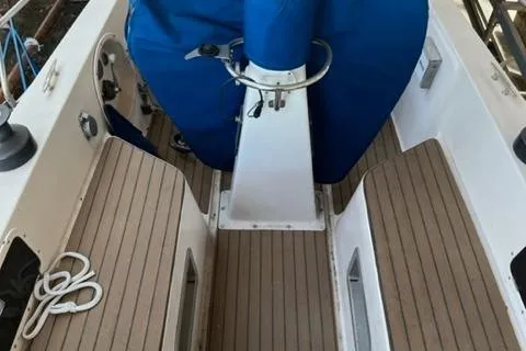 Slide: The Image of Cockpit of 1981 Nautor Swan 371 Sloop with teak flooring and blue cover. - 32