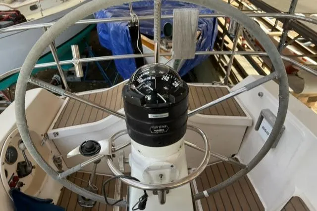 Slide: The Image of Cockpit of 1981 Nautor Swan 371 Sloop with steering wheel and compass. - 34