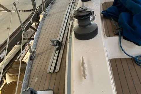 Slide: The Image of 1981 Nautor Swan 371 Sloop deck with winch and wooden details. - 38