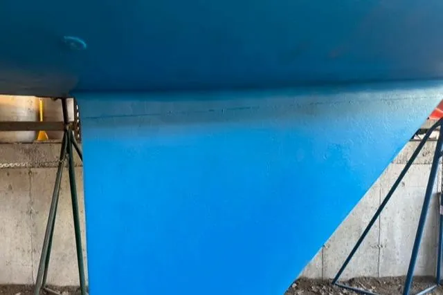 Slide: The Image of Blue hull of 1981 Nautor Swan 371 Sloop on stands. - 40