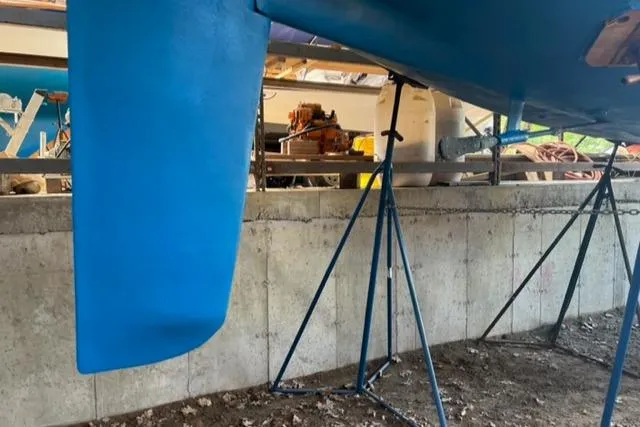 Slide: The Image of 1981 Nautor Swan 371 Sloop keel and hull on stands in a boatyard. - 41