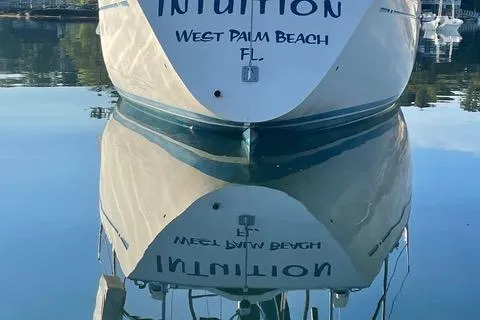 Slide: The Image of Nautor Swan 371 Sloop, 1981, docked in West Palm Beach, FL, reflecting on calm water. - 44