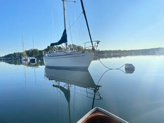 Slide: The Image of Nautor Swan 371 Sloop, 1981, anchored on calm water under clear blue sky. - 45