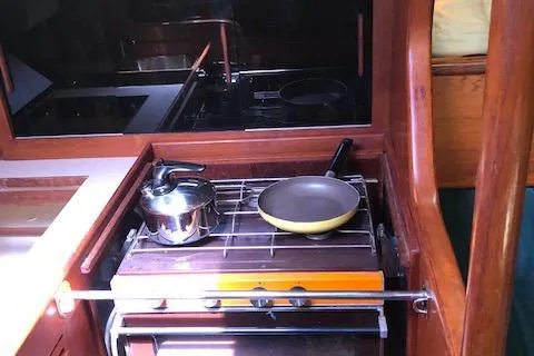 Slide: The Image of Galley kitchen in 1981 Nautor Swan 371 Sloop with stove, pot, and pan. - 6