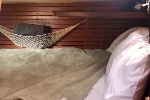 Slide: The Image of Cozy cabin interior of 1981 Nautor Swan 371 Sloop with hammock and bedding. - 7