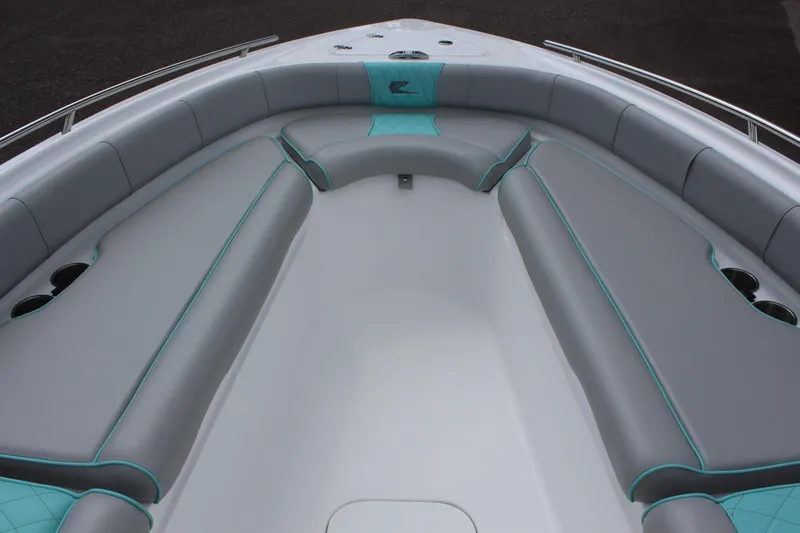Slide: The Image of 2022 ALK2 Powerboats 25 CRX bow seating area with gray and teal upholstery. - 14