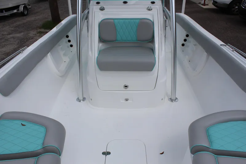 Slide: The Image of 2022 ALK2 Powerboats 25 CRX interior with teal and gray seating. - 15