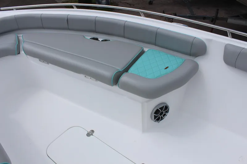 Slide: The Image of 2022 ALK2 Powerboats 25 CRX bow seating area with gray and teal upholstery. - 16
