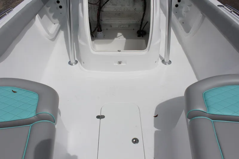 Slide: The Image of Interior of 2022 ALK2 Powerboats 25 CRX, featuring seating and storage compartments. - 18