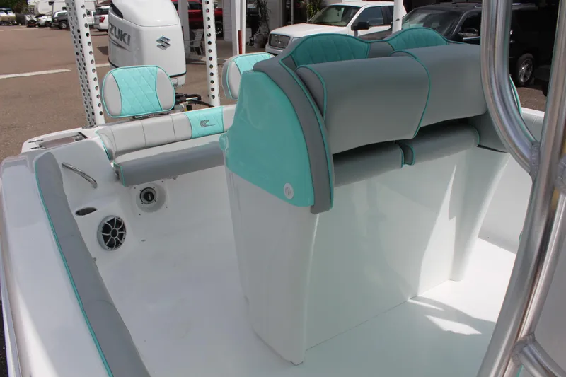 Slide: The Image of 2022 ALK2 Powerboats 25 CRX interior with teal and white seating. - 20