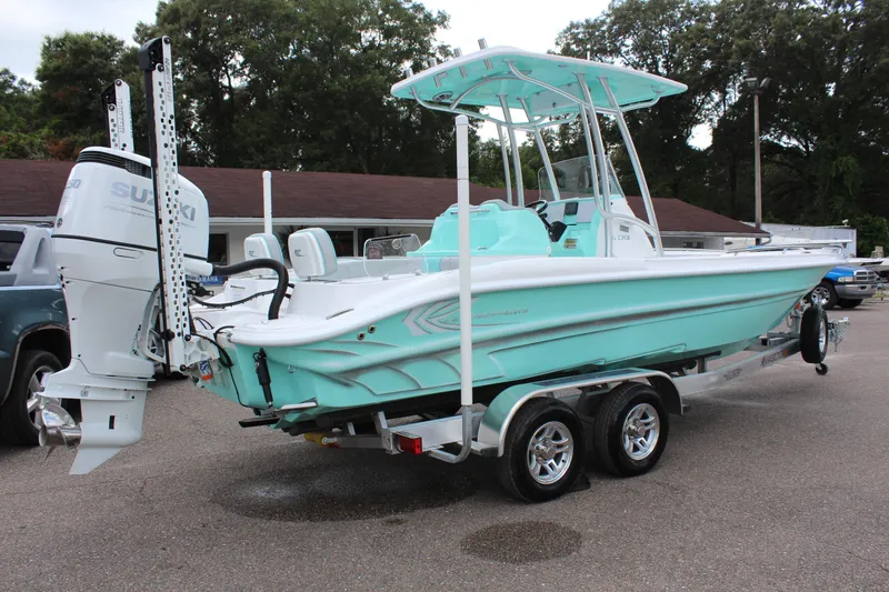 Slide: The Image of 2022 ALK2 Powerboats 25 CRX on trailer, mint green hull, Suzuki outboard motor. - 6