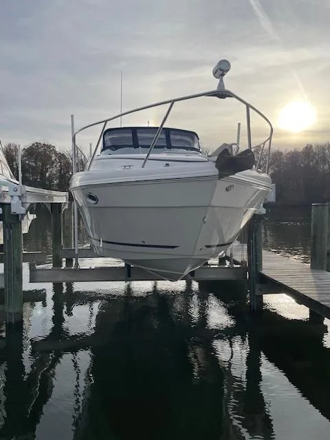Slide: The Image of 2004 Rinker 342 Express Cruiser docked at sunset on calm water. - 3