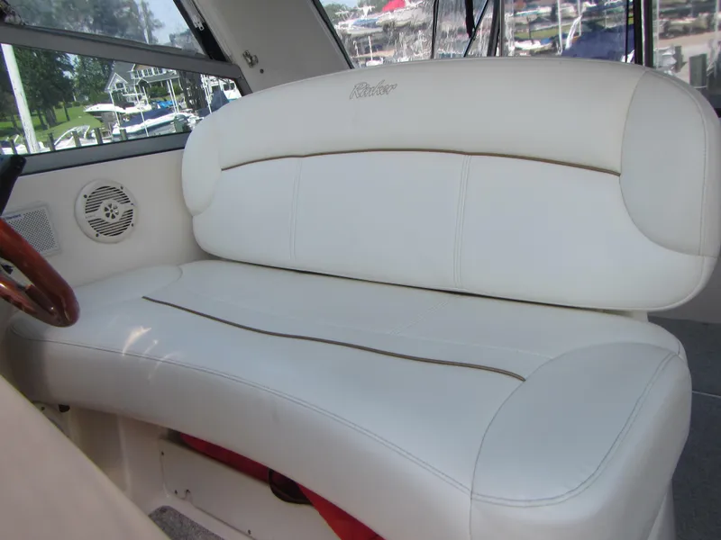 Slide: The Image of White leather seating on 2004 Rinker 342 Express Cruiser boat interior. - 39