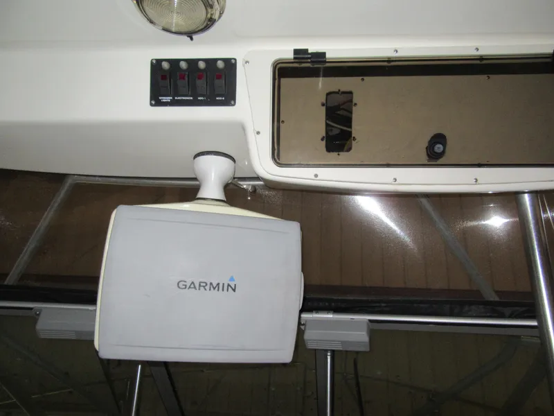 Slide: The Image of Garmin navigation system on a 2002 Boston Whaler 295 Conquest boat. - 14